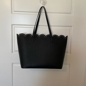 Black bag with scalloped edges.